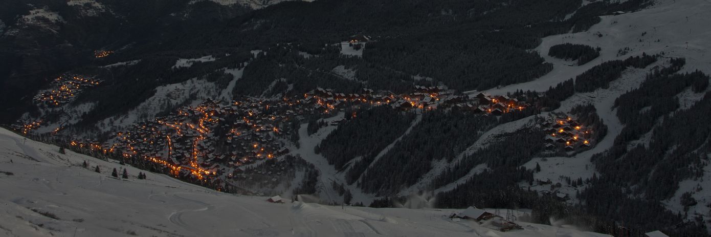 Meribel By Night with the lights and the mountains in the dark