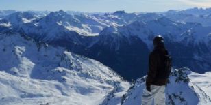 A skier or snowboarder admiring the Alpine view