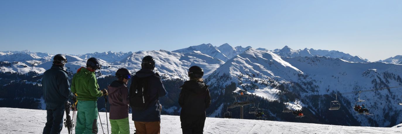 Skiers checking out the Solo Ski Holidays guide