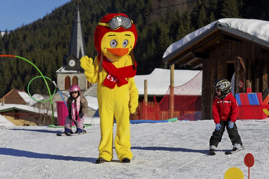 Friendly ski mascot in Les Gets