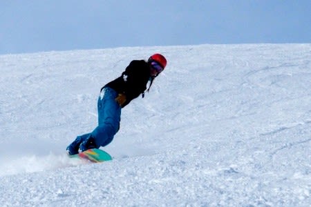 Solo Snowboarder on slope