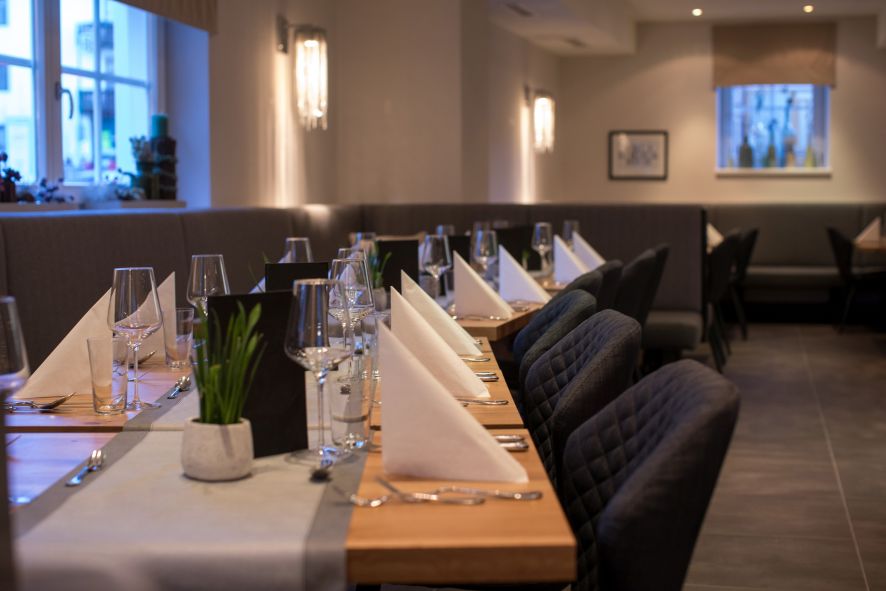 Tables set in the restaurant in Hotel Heitzmann