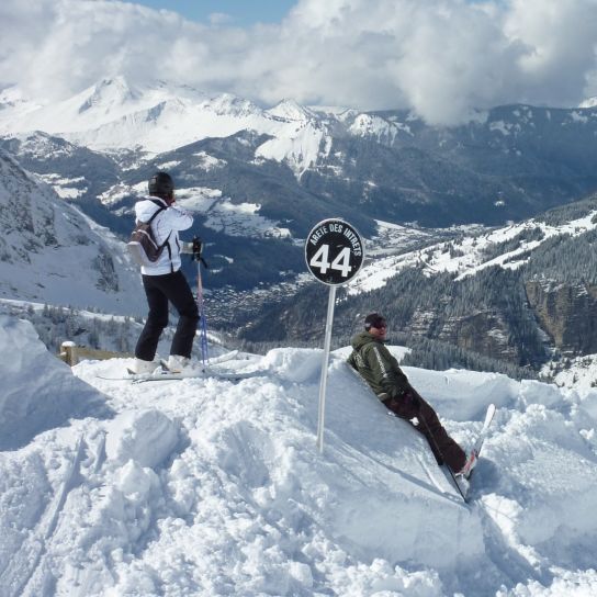 Man and woman taking a break from skiing in Avoriaz