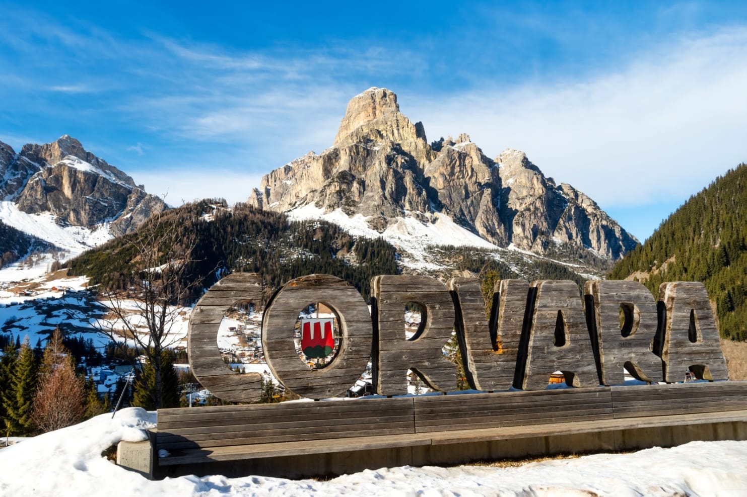 Corvara sign at the heart of The Dolomites