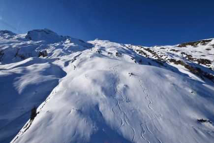 Some off pistes tracks in the snow at the top of Kaprun