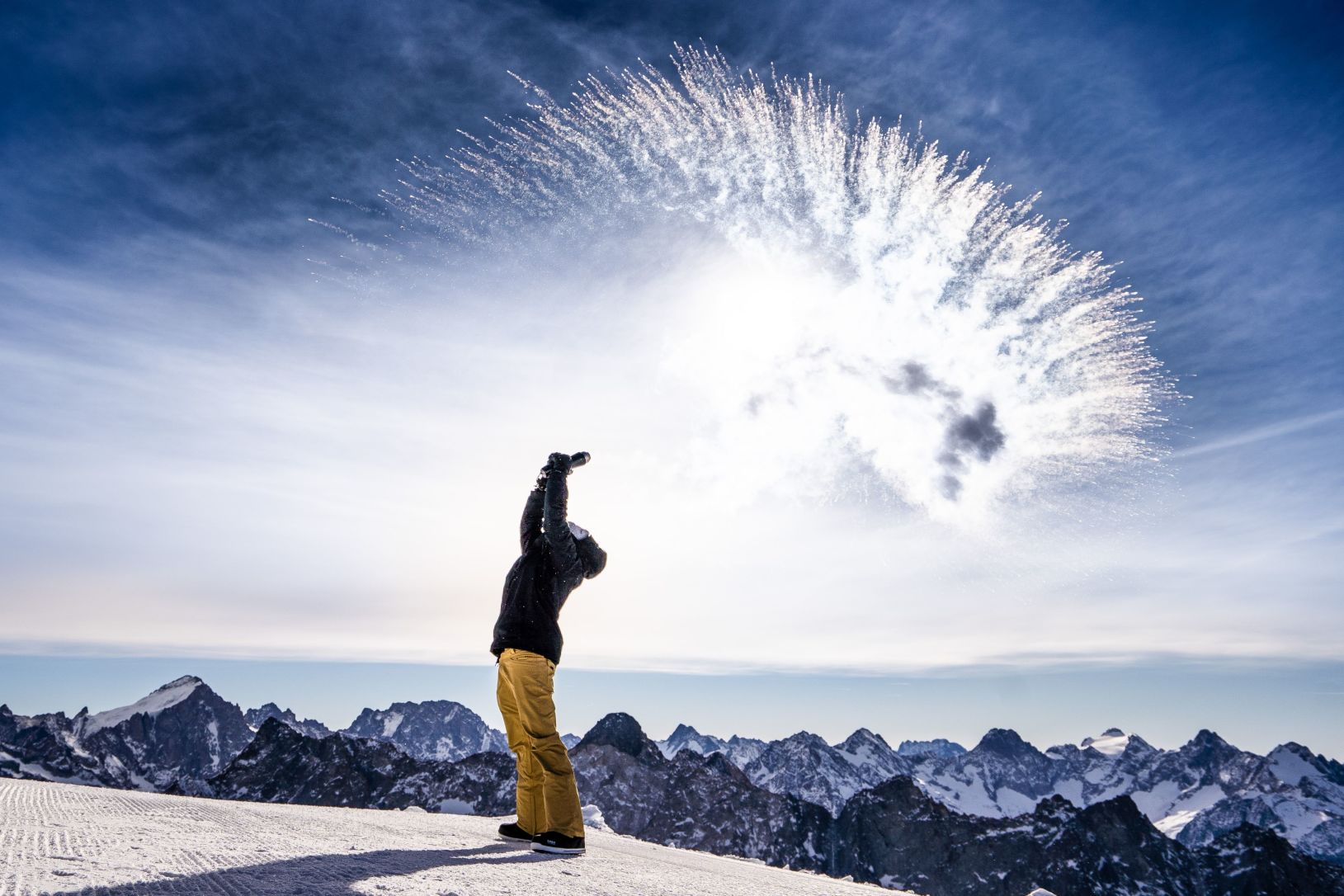 Skier throwing snow in the air