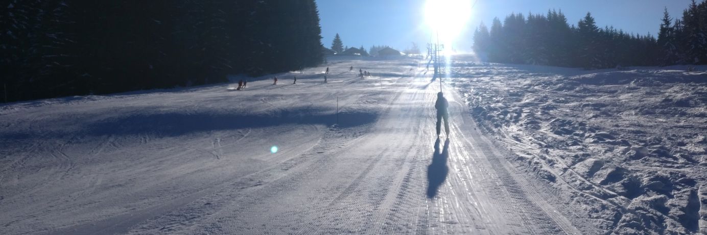 Single skier in Les Gets on the button lift