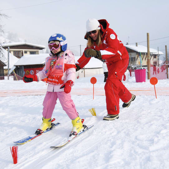 Solo skiers planning ski route in Les Gets