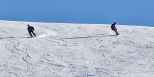 A skier vs a snowboarder. Skiing Vs Snowboarding