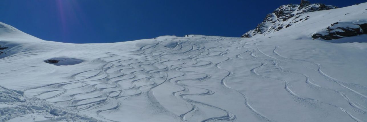 Off piste skier on Off Piste Ski Courses leave tracks in Meribel