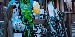 Skis and Snowboards standing outdoor