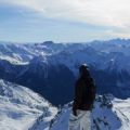 A skier or snowboarder admiring the Alpine view