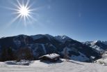 A view of Saalbach Hinterglemm Ski resort and valley with the Kohlmaisbahn gondola lift in the background