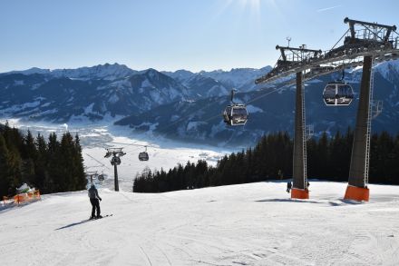 The AreitXpress gondola lift in Zell Am See with the valley floor in the background