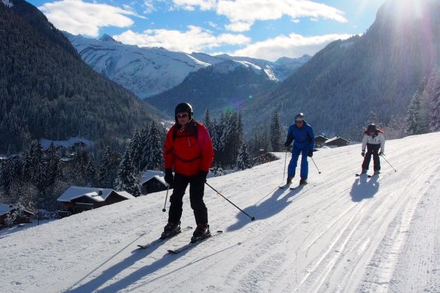 Beginners skiers on slope