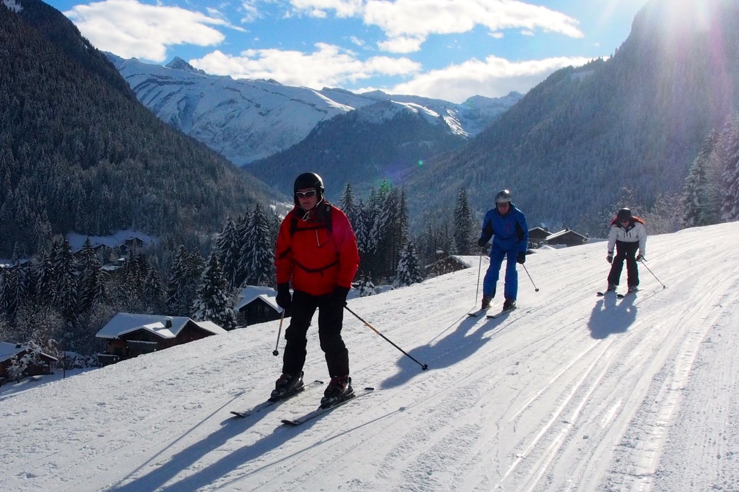 Beginner skiers relaxing in the snow