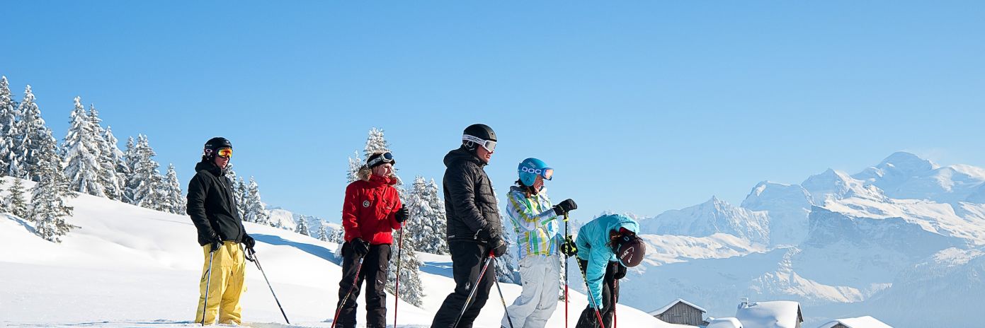 Guided skiers skiers on a course