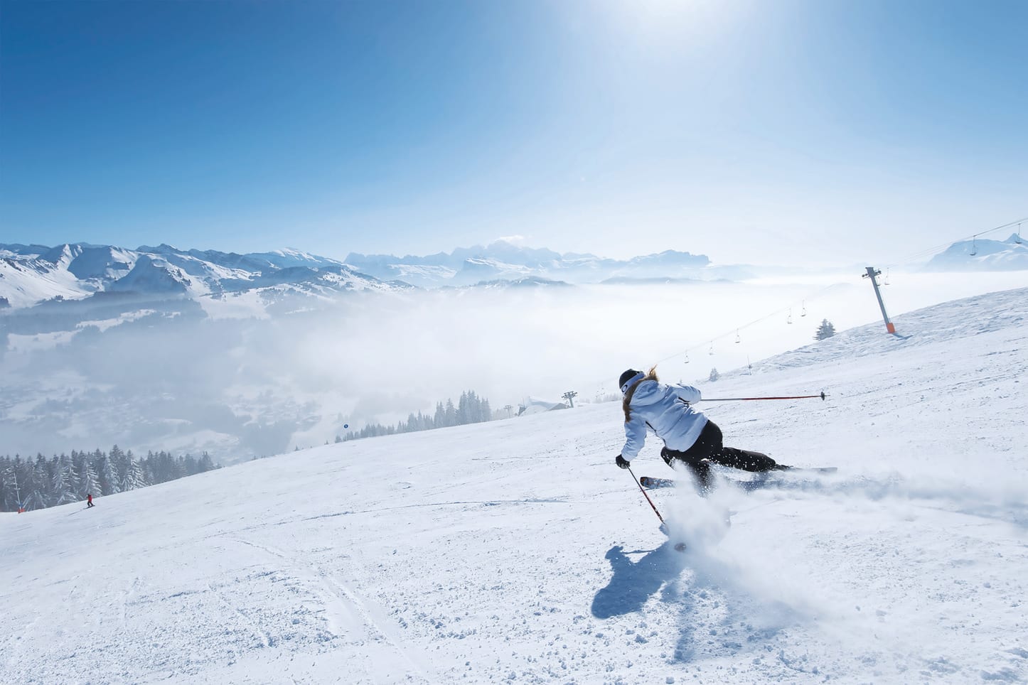 Lady doing a fast turn skiing