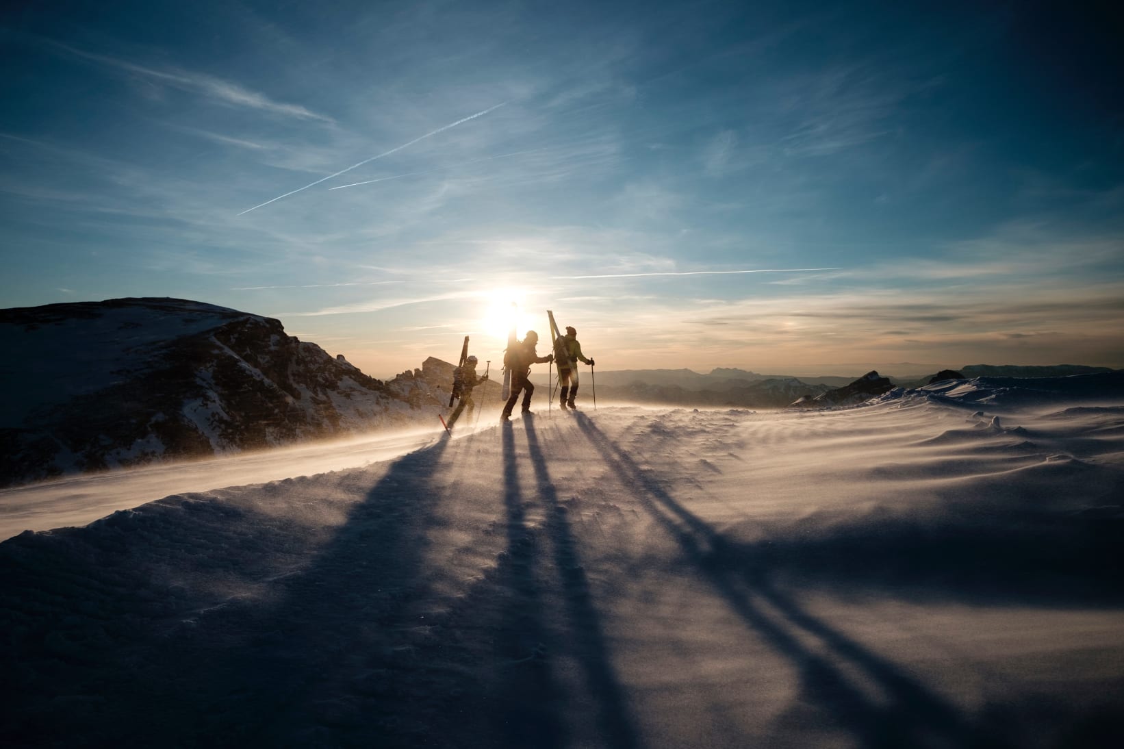 skiers at Sunset