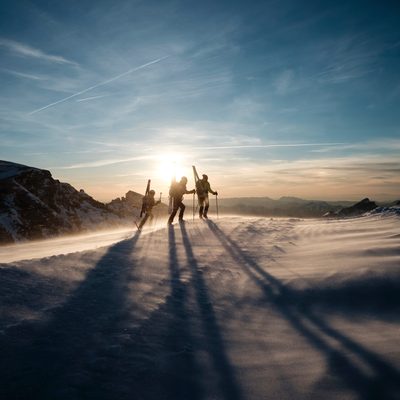 Skiers at sunset