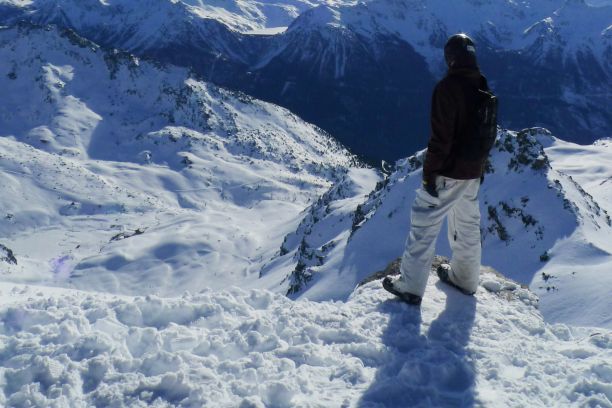 Solo skier looking out over the Mountain