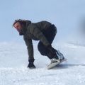 A beginner snowboarder on the mountain